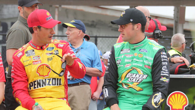 TALLADEGA, AL - APRIL 26: Joey Logano (#22 Team Penske Shell Pennzoil Ford) talks with Austin Cindric (#2 Team Penske Menards/Quaker State Ford) during qualifying for the NASCAR Cup Series Jack Link's 500 on April 26, 2025 at Talladega SuperSpeedway in Talladega, AL.