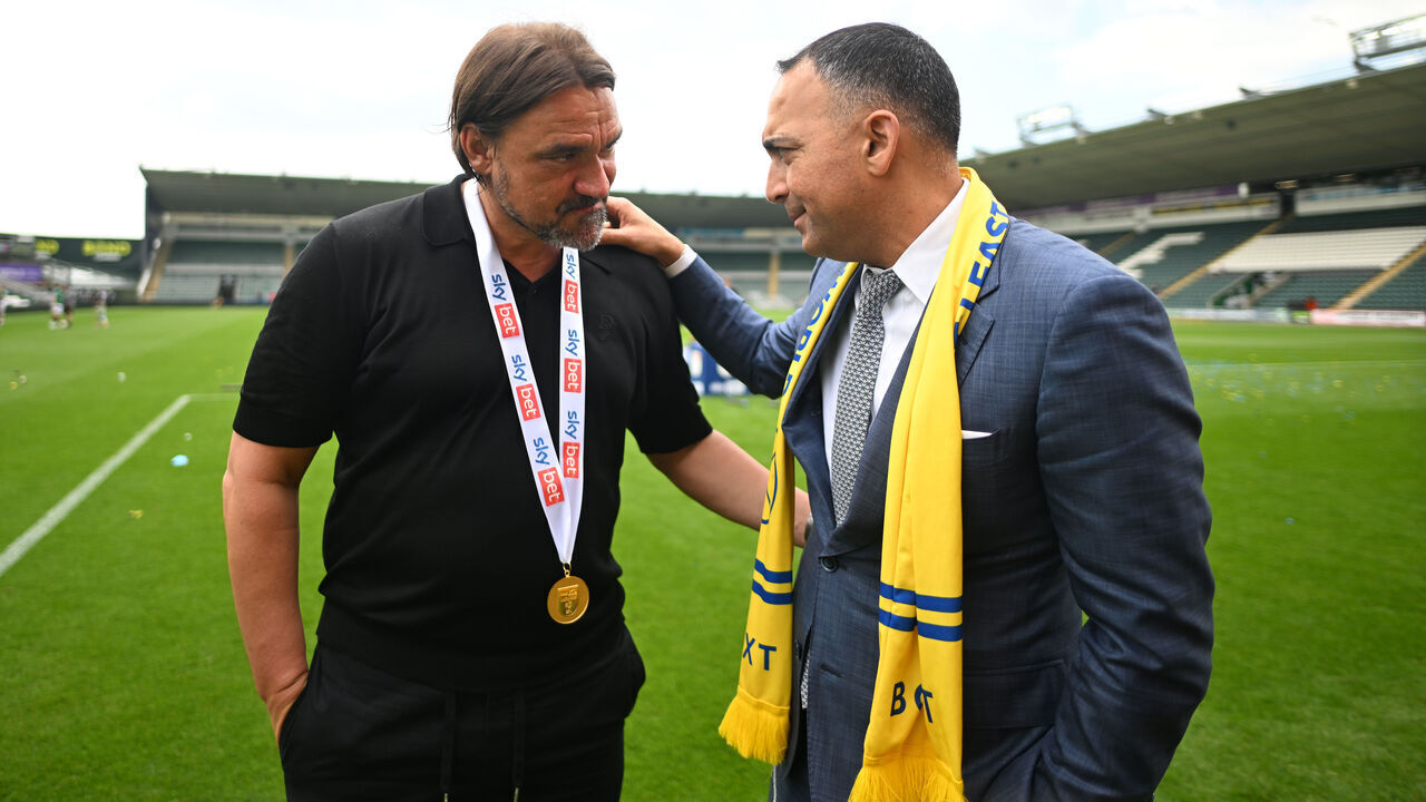 PLYMOUTH, ENGLAND - MAY 03: Daniel Farke, Manager of Leeds United, embraces Paraag Marathe, Chairman of Leeds United and minority shareholder of the 49ers Enterprise group Limited who own Leeds United, after the teams 2-1 victory, which confirmed that the team has won the Sky Bet Championship and promotion to the Premier League following the Sky Bet Championship match between Plymouth Argyle FC and Leeds United FC at Home Park on May 03, 2025 in Plymouth, England.