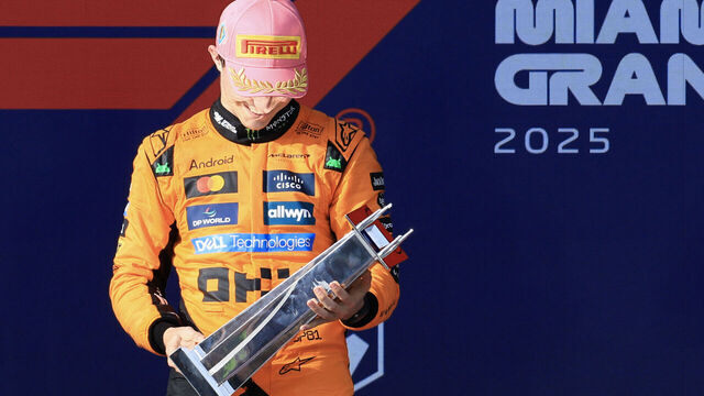 McLaren's Australian driver Oscar Piastri looks at his trophy after winning the 2025 Miami Formula One Grand Prix at Miami International Autodrome in Miami Gardens, Florida, on May 4, 2025.