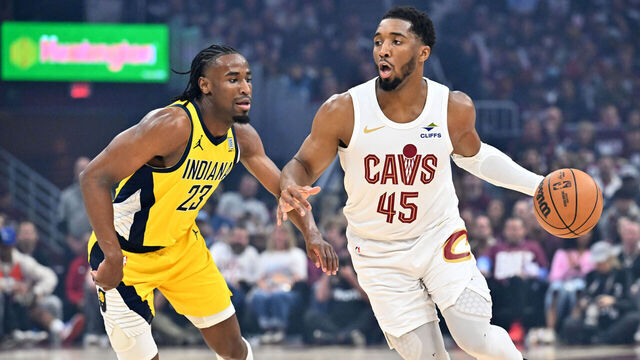 CLEVELAND, OHIO - MAY 04: Aaron Nesmith #23 of the Indiana Pacers guards Donovan Mitchell #45 of the Cleveland Cavaliers during the first quarter of game one of the Eastern Conference Semifinals at Rocket Arena on May 04, 2025 in Cleveland, Ohio.