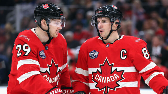 BOSTON, MASSACHUSETTS - FEBRUARY 17: Nathan MacKinnon #29 and Sidney Crosby #87 of Team Canada chat prior to a second period faceoff against Team Finland in the 4 Nations Face-Off game at TD Garden on February 17, 2025 in Boston, Massachusetts.