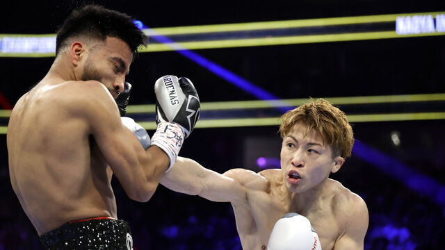 LAS VEGAS, NEVADA - MAY 04: Undisputed junior featherweight champion Naoya Inoue (R) punches Ramon Cardenas in the first round of their title fight at T-Mobile Arena on May 04, 2025 in Las Vegas, Nevada.