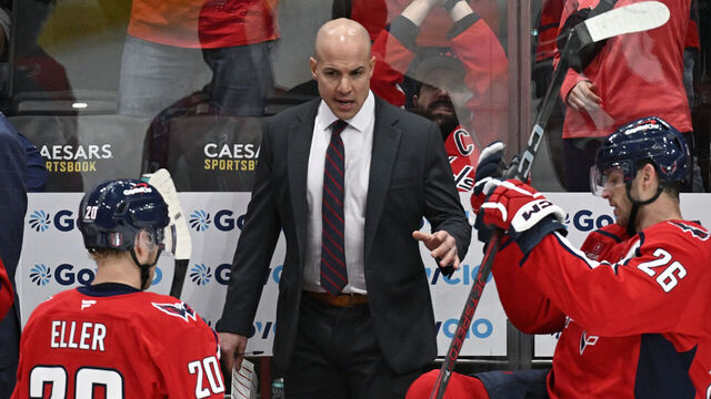 WASHINGTON, DC - APRIL 23: Washington Capitals center Lars Eller (20) and Capitals center Nic Dowd (26) listen head coach Spencer Carbery during the third period of game two of a first round playoff hockey game at Capital One Arena in Washington, DC on April 23, 2025.