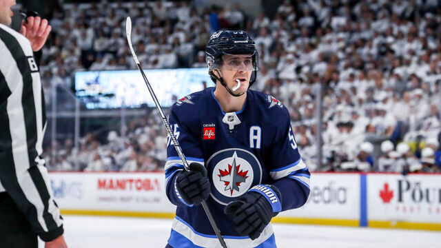 WINNIPEG, CANADA - APRIL 19: Mark Scheifele #55 of the Winnipeg Jets gets set to take a second period face-off against the St. Louis Blues in Game One of the First Round of the 2025 Stanley Cup Playoffs at the Canada Life Centre on April 19, 2025 in Winnipeg, Manitoba, Canada. The Jets defeated the Blues 5-3 and lead the series 1-0.