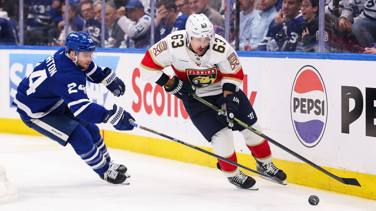 TORONTO, CANADA - MAY 5: Brad Marchand #63 of the Florida Panthers skates with the puck against Scott Laughton #24 of the Toronto Maple Leafs during the second period of Game One of the Second Round of the 2025 Stanley Cup Playoffs at Scotiabank Arena on May 5, 2025 in Toronto, Ontario, Canada.