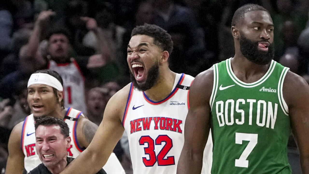 Boston, MA - May 7: Boston Celtics guard Jaylen Brown and forward Jayson Tatum lament the loss as New York Knicks center Karl-Anthony Towns celebrates in the background after Game 2 of the Eastern Conference Semifinals at TD Garden.