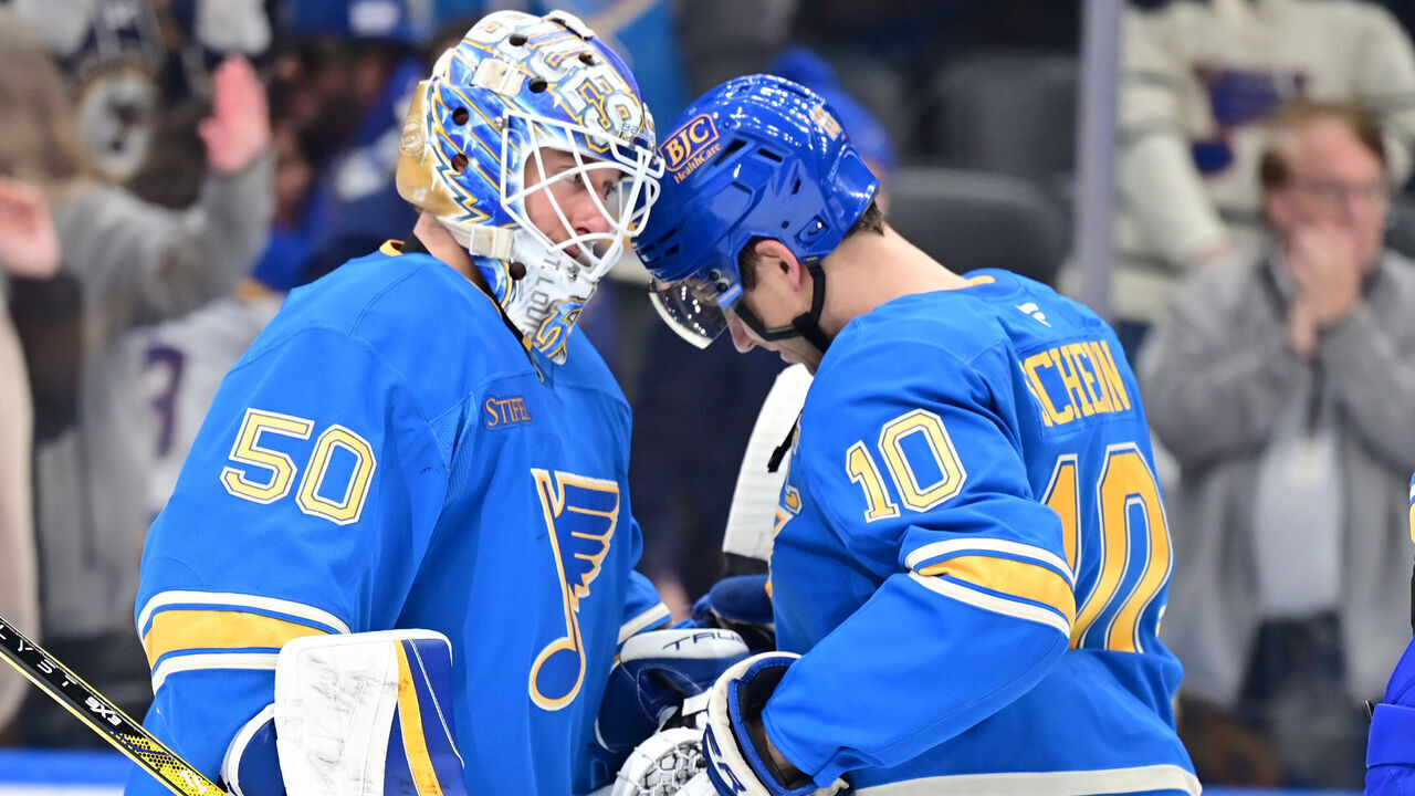 ST. LOUIS, MO -APRIL 05: St. Louis Blues center Brayden Schenn (10) congratulates St. Louis Blues goaltender Jordan Binnington (50) after winning a NHL game between the Colorado Avalanche and the St. Louis Blues on April 05, 2025, at Enterprise Center, St. Louis MO.