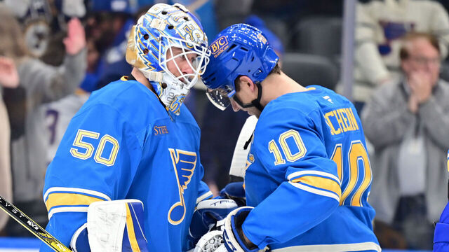 ST. LOUIS, MO -APRIL 05: St. Louis Blues center Brayden Schenn (10) congratulates St. Louis Blues goaltender Jordan Binnington (50) after winning a NHL game between the Colorado Avalanche and the St. Louis Blues on April 05, 2025, at Enterprise Center, St. Louis MO.
