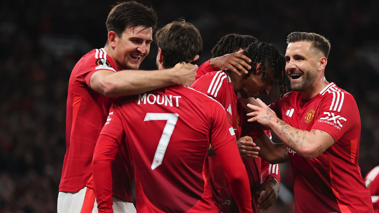 MANCHESTER, ENGLAND - MAY 08: Mason Mount of Manchester United (obscured) celebrates scoring his team's first goal with teammate Harry Maguire during the UEFA Europa League 2024/25 Semi Final Second Leg match between Manchester United and Athletic Club at Old Trafford on May 08, 2025 in Manchester, England.