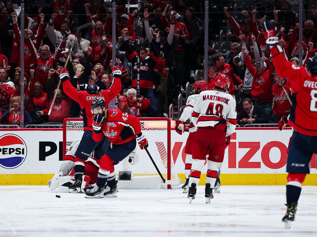 WASHINGTON, DC - MAY 08: Alex Ovechkin #8, Tom Wilson #43, and Jakob Chychrun #6 of the Washington Capitals celebrate after teammate John Carlson #74 scored a goal against Frederik Andersen #31 of the Carolina Hurricanes during the third period in Game Two of the Second Round of the 2025 Stanley Cup Playoffs at Capital One Arena on May 8, 2025 in Washington, DC.