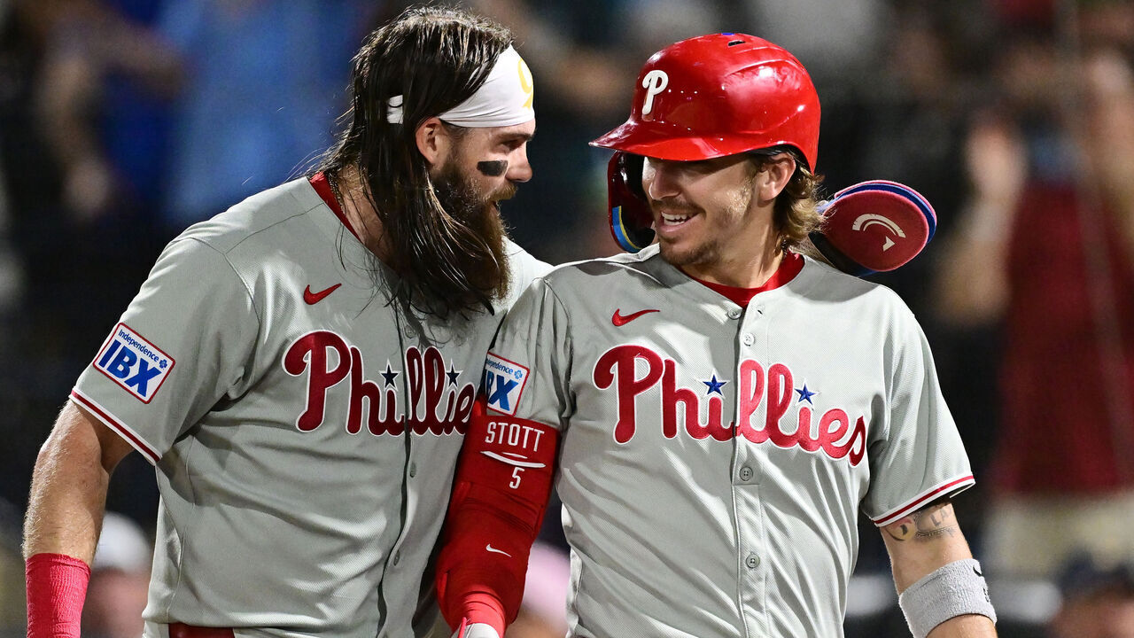 TAMPA, FLORIDA - MAY 08: Bryson Stott #5 celebrates with Brandon Marsh #16 of the Philadelphia Phillies after hitting a three-run home run in the eighth inning against the Tampa Bay Rays at George M. Steinbrenner Field on May 08, 2025 in Tampa, Florida.