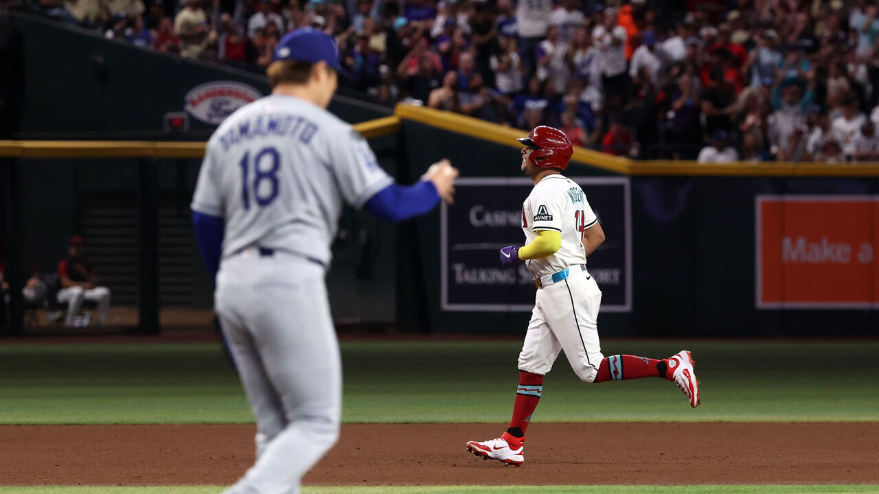 PHOENIX, ARIZONA - MAY 08: Gabriel Moreno #14 of the Arizona Diamondbacks runs the bases after hitting a grand slam home run during the fourth inning against the Los Angeles Dodgers at Chase Field on May 08, 2025 in Phoenix, Arizona.