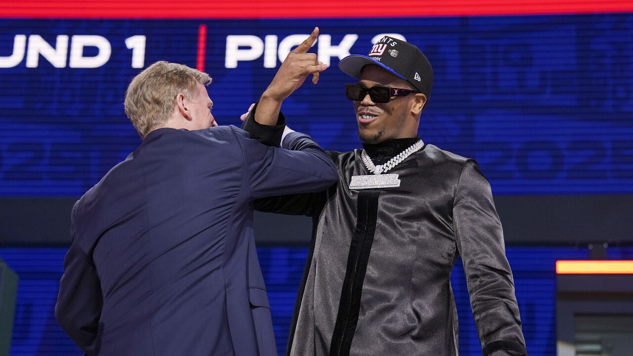 GREEN BAY, WISCONSIN - APRIL 24: Penn State defensive end Abdul Carter and Commissioner Roger Goodell celebrate after being selected third overall by the New York Giants during the first round of the 2025 NFL Draft on April 24, 2025 in Green Bay, Wisconsin.