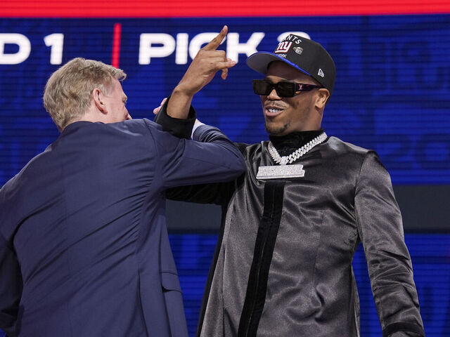GREEN BAY, WISCONSIN - APRIL 24: Penn State defensive end Abdul Carter and Commissioner Roger Goodell celebrate after being selected third overall by the New York Giants during the first round of the 2025 NFL Draft on April 24, 2025 in Green Bay, Wisconsin.