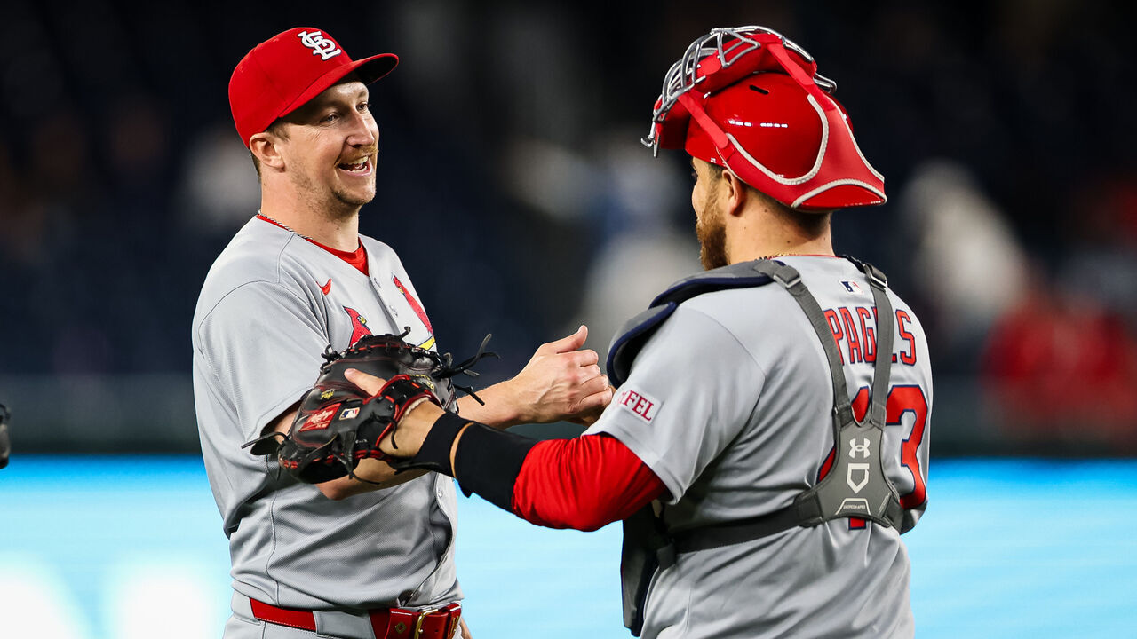 WASHINGTON, DC - MAY 09: Erick Fedde #12 of the St. Louis Cardinals celebrates with Pedro Pagés #43 after pitching a complete game shutout against the Washington Nationals at Nationals Park on May 9, 2025 in Washington, DC.