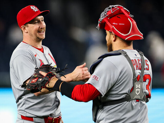 WASHINGTON, DC - MAY 09: Erick Fedde #12 of the St. Louis Cardinals celebrates with Pedro Pagés #43 after pitching a complete game shutout against the Washington Nationals at Nationals Park on May 9, 2025 in Washington, DC.