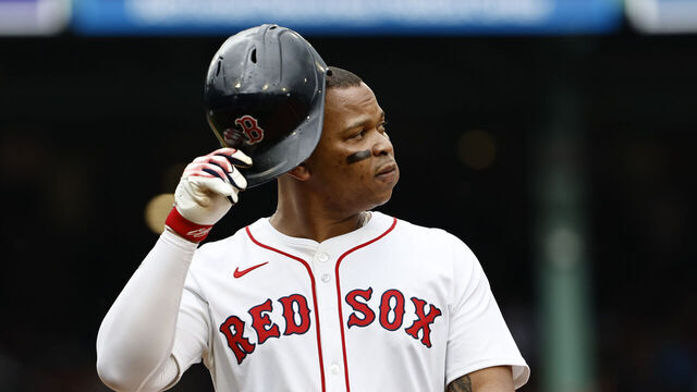 BOSTON, MA - MAY 4: Rafael Devers #11 of the Boston Red Sox heads for the dugout after flying out against the Minnesota Twins during the second inning at Fenway Park on May 4, 2025 in Boston, Massachusetts.