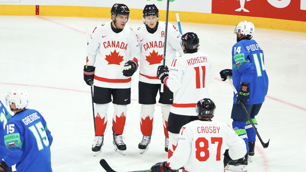 STOCKHOLM, SWEDEN - MAY 10: Bo Horvat #14 of Team Canada celebrate his first goal with captain, Sidney Crosby #87 and teammattes during the 2025 Ice Hockey World Championship match between Slovenia and Canada at Avicii Arena on May 10, 2025 in Stockholm, Sweden.