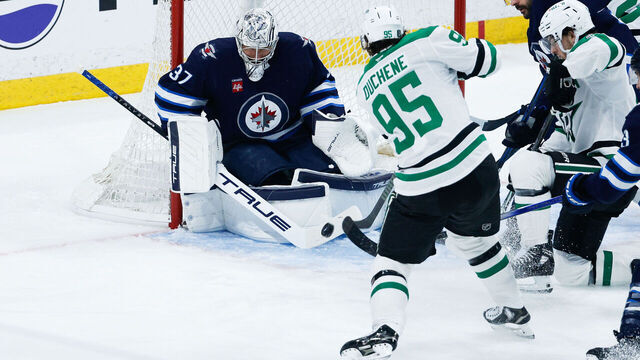 WINNIPEG, MB - MAY 09: Dallas Stars forward Matt Duchene (95) is stopped by Winnipeg Jets goalie Connor Hellebuyck (37) in game 2 of the second round of the Stanley Cup Playoffs between the Winnipeg Jets and the Dallas Stars on May 09, 2025 at the Canada Life Centre Winnipeg, Manitoba.