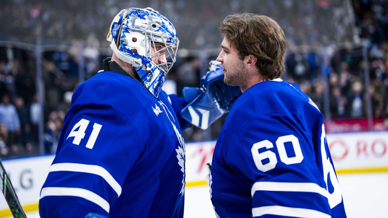 TORONTO, ON - APRIL 2: Joseph Woll #60 congratulates Anthony Stolarz #41 of the Toronto Maple Leafs on a win over the Florida Panthers at the Scotiabank Arena on April 2, 2025 in Toronto, Ontario, Canada.