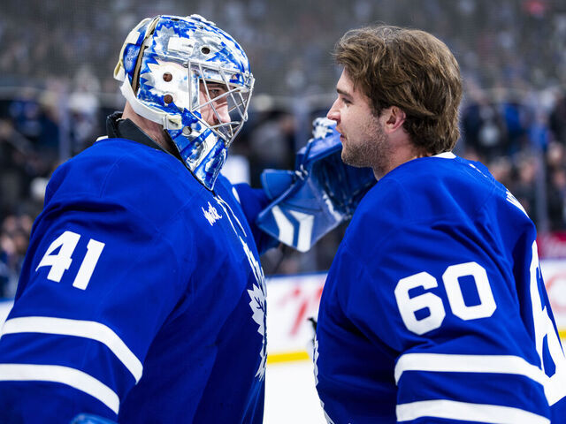 TORONTO, ON - APRIL 2: Joseph Woll #60 congratulates Anthony Stolarz #41 of the Toronto Maple Leafs on a win over the Florida Panthers at the Scotiabank Arena on April 2, 2025 in Toronto, Ontario, Canada.