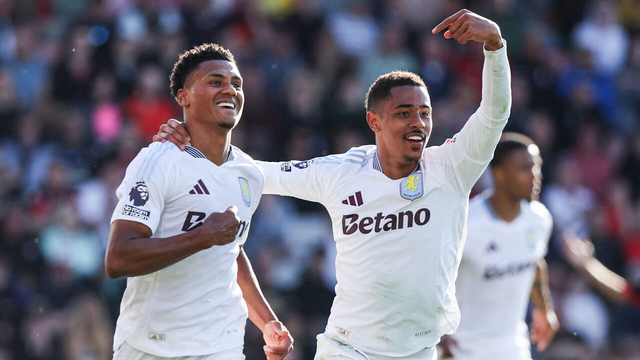 TOPSHOT - Aston Villa's English striker #11 Ollie Watkins (L) celebrates with Aston Villa's English midfielder #41 Jacob Ramsey after scoring his team first goal during the English Premier League football match between Bournemouth and Aston Villa at the Vitality Stadium in Bournemouth, southern England on May 10, 2025.