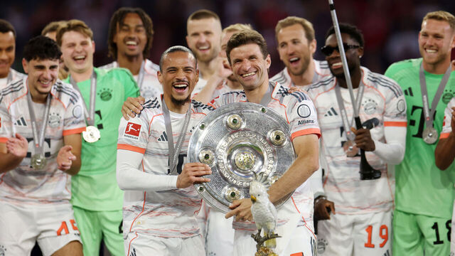 MUNICH, GERMANY - MAY 10: Thomas Mueller and Leroy Sane of Bayern Munich celebrate with the Meisterschale trophy after the teams 2-0 victory in the Bundesliga match between FC Bayern München and Borussia Mönchengladbach at Allianz Arena on May 10, 2025 in Munich, Germany.