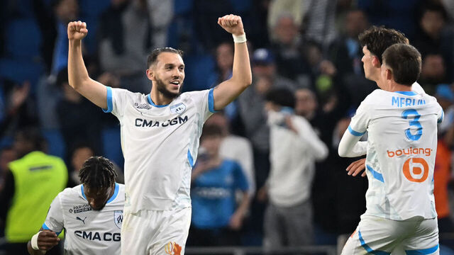TOPSHOT - Marseille's Algerian forward #09 Amine Gouiri (L) celebrates after scoring his team's third goal at the end of the French L1 football match between Le Havre AC and Olympique de Marseille (OM) at The Stade Oceane in Le Havre, north-western France, on May 10, 2025. Shortly after the hour mark and opening goal of Marseille, a brawl broke out in a corner adjacent to the Le Havre kop and spectators left the stand to take cover, bringing the match to a halt in the 64th minute and prompting referee Willy Delajod to send the players back to the dressing room.