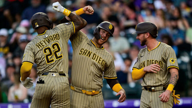 DENVER, CO - MAY 10: San Diego Padres outfielder Jason Heyward (22) celebrates his fourth inning three-run home run with Gavin Sheets (30) and Jackson Merrill (3) during a game between the San Diego Padres and the Colorado Rockies at Coors Field on May 10, 2025 in Denver, Colorado.