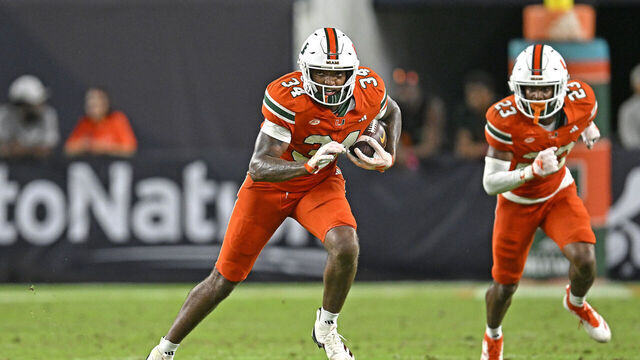 MIAMI GARDENS, FL - SEPTEMBER 07: Miami linebacker Adarius Hayes (34), followed by defensive back Dylan Day (23), returns an interception 25 yards in the fourth quarter as the Miami Hurricanes faced the Florida A&M Rattlers on September 7, 2024, at Hard Rock Stadium in Miami Gardens, Florida.