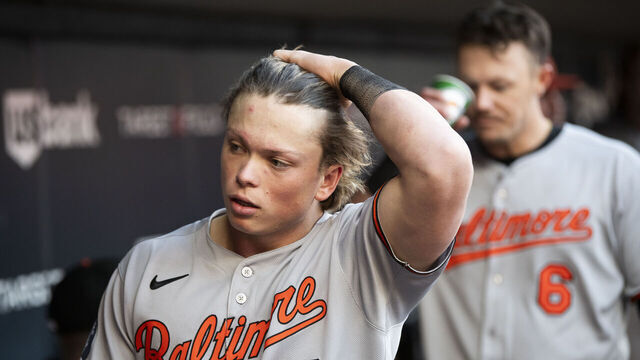 MINNEAPOLIS, MINNESOTA - MAY 7: Jackson Holliday #7 of the Baltimore Orioles looks on from the dugout in the fourth inning of the game against the Minnesota Twins at Target Field on May 7, 2025 in Minneapolis, Minnesota.