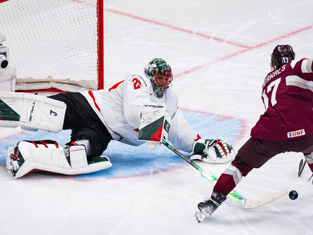 Canada's goaltender #29 Marc Andre Fleury reaches out to block the puck from Latvia's forward #17 Martins Dzierkals during the IIHF Men's Ice hockey World Championship match between Latvia and Canada in Stockholm, on May 11, 2025.