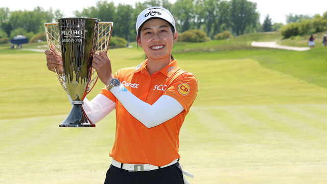 JERSEY CITY, NEW JERSEY - MAY 11: Jeeno Thitikul of Thailand poses with the winner's trophy after the final round of the Mizuho Americas Open 2025 at Liberty National Golf Club on May 11, 2025 in Jersey City, New Jersey.