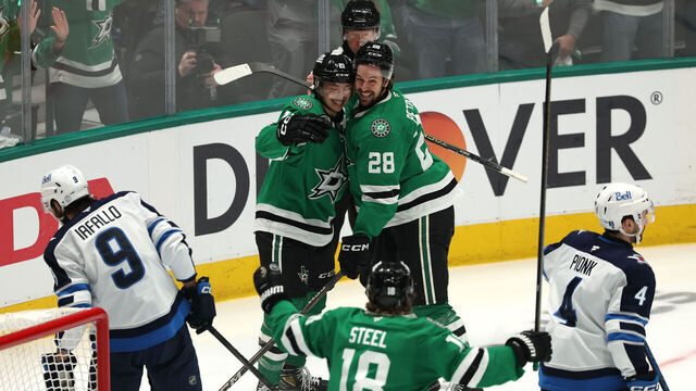 DALLAS, TEXAS - MAY 11: Alexander Petrovic #28 of the Dallas Stars celebrates with Jason Robertson #21 and Sam Steel #18 after scoring a goal against the Winnipeg Jets during the third period of Game Three of the Second Round in the 2025 Stanley Cup Playoffs at American Airlines Center on May 11, 2025 in Dallas, Texas.