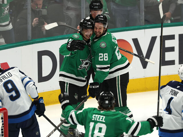 DALLAS, TEXAS - MAY 11: Alexander Petrovic #28 of the Dallas Stars celebrates with Jason Robertson #21 and Sam Steel #18 after scoring a goal against the Winnipeg Jets during the third period of Game Three of the Second Round in the 2025 Stanley Cup Playoffs at American Airlines Center on May 11, 2025 in Dallas, Texas.