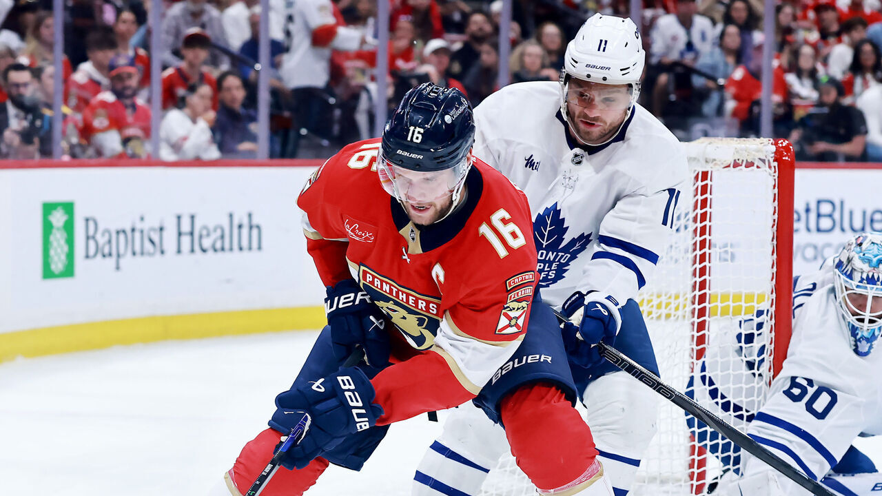 SUNRISE, FLORIDA - MAY 11: Aleksander Barkov #16 of the Florida Panthers and Max Domi #11 of the Toronto Maple Leafs fight for possession of the puck during the second period in Game Four of the Second Round of the 2025 Stanley Cup Playoffs at Amerant Bank Arena on May 11, 2025 in Sunrise, Florida.