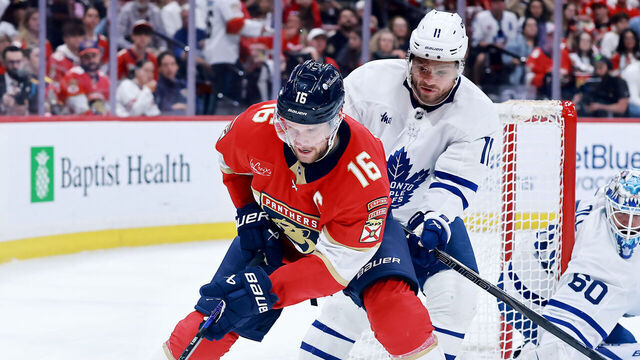 SUNRISE, FLORIDA - MAY 11: Aleksander Barkov #16 of the Florida Panthers and Max Domi #11 of the Toronto Maple Leafs fight for possession of the puck during the second period in Game Four of the Second Round of the 2025 Stanley Cup Playoffs at Amerant Bank Arena on May 11, 2025 in Sunrise, Florida.