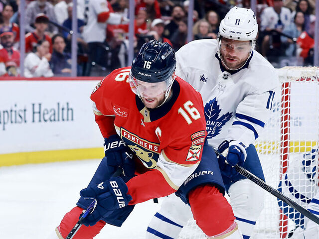 SUNRISE, FLORIDA - MAY 11: Aleksander Barkov #16 of the Florida Panthers and Max Domi #11 of the Toronto Maple Leafs fight for possession of the puck during the second period in Game Four of the Second Round of the 2025 Stanley Cup Playoffs at Amerant Bank Arena on May 11, 2025 in Sunrise, Florida.