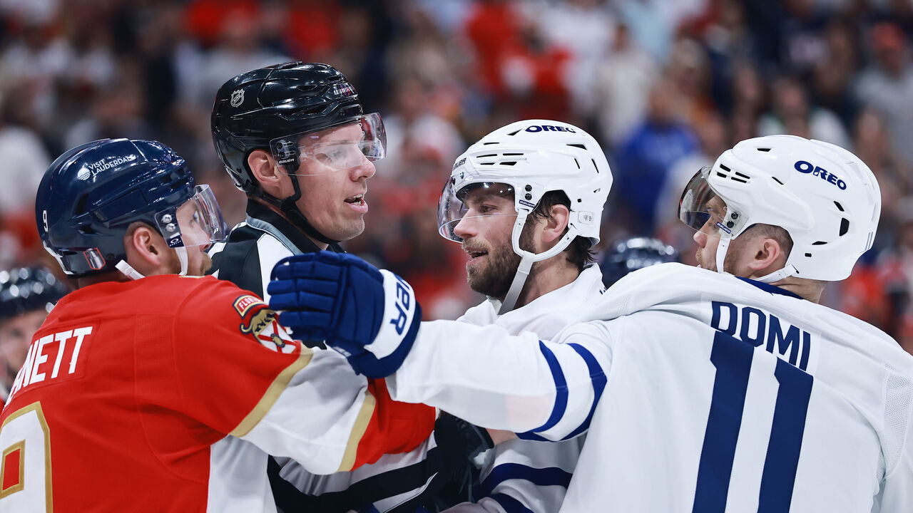 SUNRISE, FLORIDA - MAY 11: Sam Bennett #9 of the Florida Panthers and Max Domi #11 of the Toronto Maple Leafs are separated by a referee during the third period in Game Four of the Second Round of the 2025 Stanley Cup Playoffs at Amerant Bank Arena on May 11, 2025 in Sunrise, Florida.