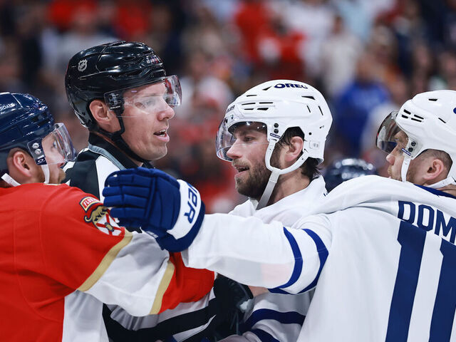 SUNRISE, FLORIDA - MAY 11: Sam Bennett #9 of the Florida Panthers and Max Domi #11 of the Toronto Maple Leafs are separated by a referee during the third period in Game Four of the Second Round of the 2025 Stanley Cup Playoffs at Amerant Bank Arena on May 11, 2025 in Sunrise, Florida.