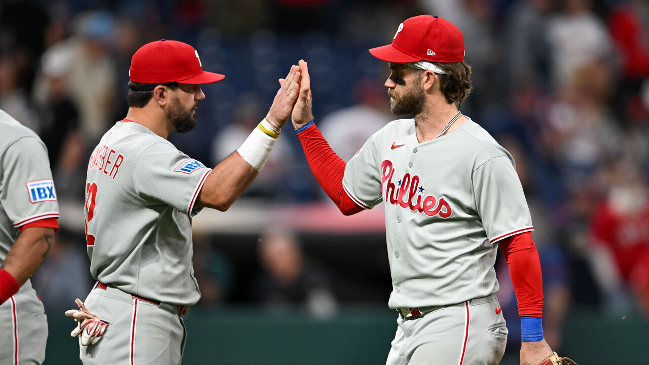 CLEVELAND, OHIO - MAY 10: Kyle Schwarber #12 and Bryce Harper #3 of the Philadelphia Phillies celebrate the team's 7-1 win over the Cleveland Guardians at Progressive Field on May 10, 2025 in Cleveland, Ohio.