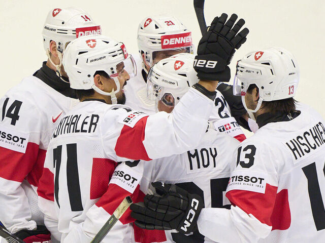 ODENSE, DENMARK - MAY 12: Jonas Siegenthaler #71 of Switzerland celebrates his 0-2 goal with Nico Hirschier #13 of Switzerland Dean Kukan #14 of Switzerland Tyler Moy #92 of Switzerland during the 2025 Ice Hockey World Championship match between United States and Switzerland at Jyske Bank Arena on May 12, 2025 in Odense, Denmark.