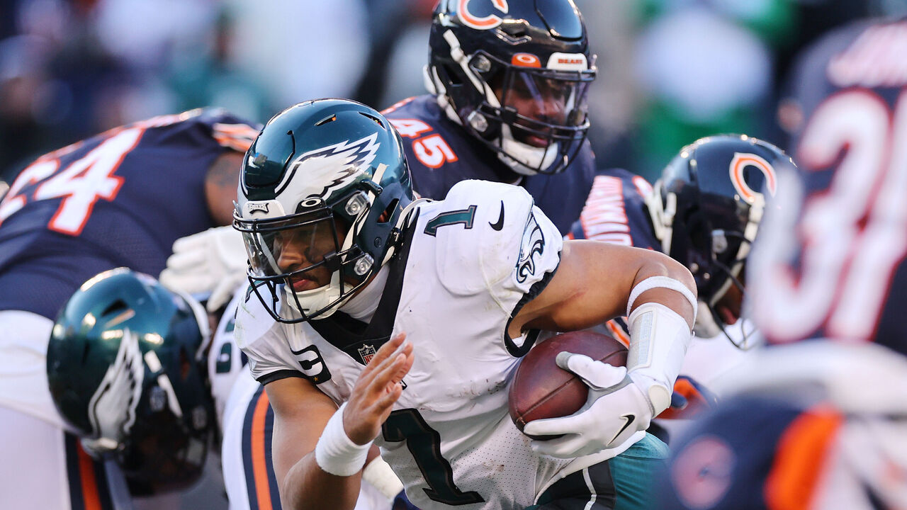 CHICAGO, ILLINOIS - DECEMBER 18: Jalen Hurts #1 of the Philadelphia Eagles runs for a successful two point conversion against the Chicago Bears during the fourth quarter at Soldier Field on December 18, 2022 in Chicago, Illinois.