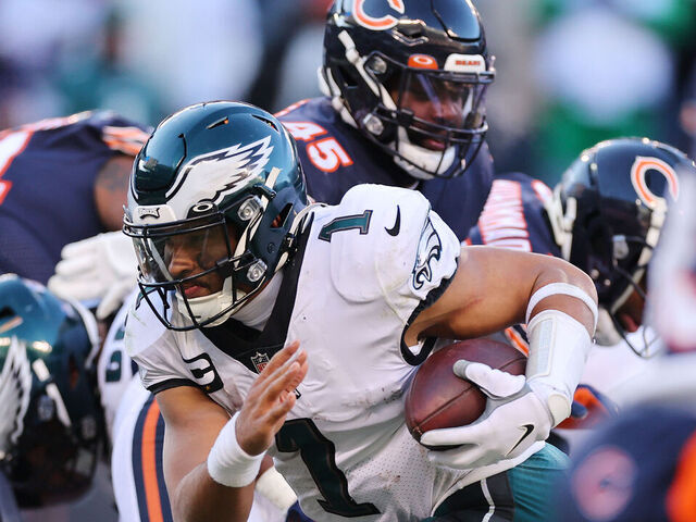 CHICAGO, ILLINOIS - DECEMBER 18: Jalen Hurts #1 of the Philadelphia Eagles runs for a successful two point conversion against the Chicago Bears during the fourth quarter at Soldier Field on December 18, 2022 in Chicago, Illinois.