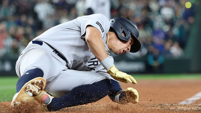 SEATTLE, WASHINGTON - MAY 12: Oswaldo Cabrera #95 of the New York Yankees scores a run against the Seattle Mariners during the ninth inning but injures himself at T-Mobile Park on May 12, 2025 in Seattle, Washington.