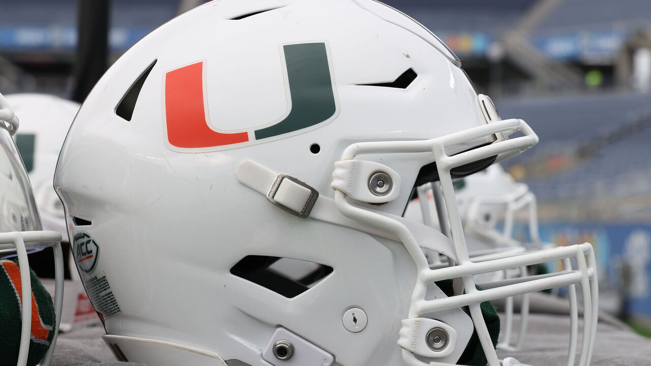 ORLANDO, FL - DECEMBER 28: a Miami Hurricanes helmet rests near the sidelines before the Pop-Tarts Bowl game between the Iowa State Cyclones and the Miami Hurricanes on Saturday, December 28, 2024 at Camping World Stadium in Orlando, Fla.