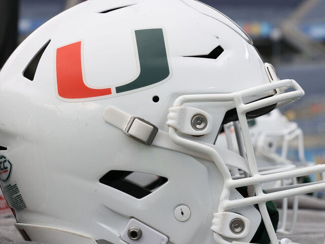 ORLANDO, FL - DECEMBER 28: a Miami Hurricanes helmet rests near the sidelines before the Pop-Tarts Bowl game between the Iowa State Cyclones and the Miami Hurricanes on Saturday, December 28, 2024 at Camping World Stadium in Orlando, Fla.