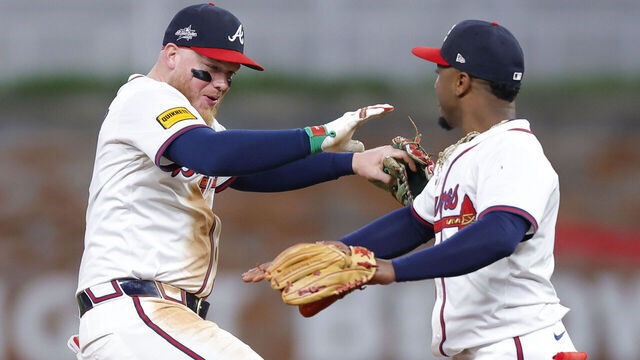 ATLANTA, GEORGIA - MAY 13: Alex Verdugo #8 and Ozzie Albies #1 of the Atlanta Braves react at the conclusion of their team's 5-2 victory over the Washington Nationals at Truist Park on May 13, 2025 in Atlanta, Georgia.