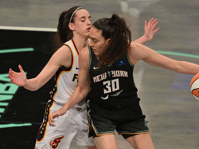 Indiana Fever #22 Caitlin Clark guards New York Liberty #30 Breanna Stewart during a WNBA game between the Fever and Liberty, at the Barclays Center in Brooklyn on May 18, 2024, in New York City.