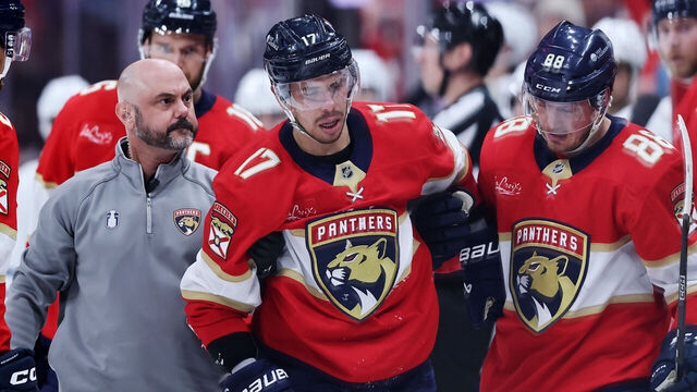 SUNRISE, FLORIDA - MAY 11: Evan Rodrigues #17 of the Florida Panthers is helped up after being checked during the third period against the Toronto Maple Leafs in Game Four of the Second Round of the 2025 Stanley Cup Playoffs at Amerant Bank Arena on May 11, 2025 in Sunrise, Florida.